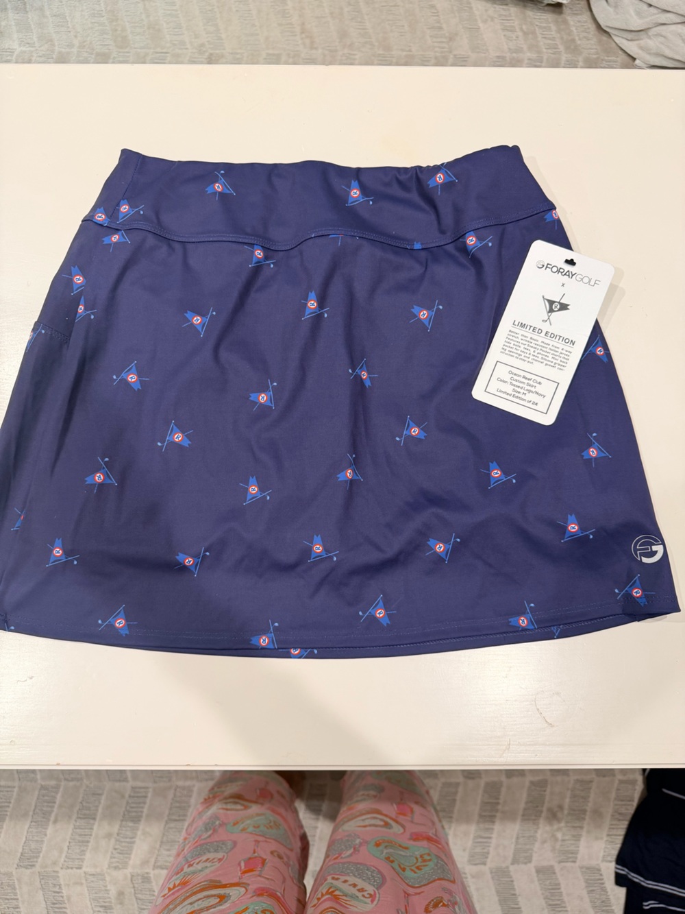 G/FORE Navy ocean reef special edition tennis skirt with Blue and Red Flag Motif